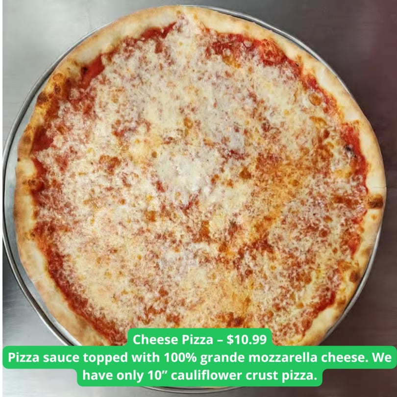 A whole cheese pizza with melted mozzarella and red sauce on a metal tray.