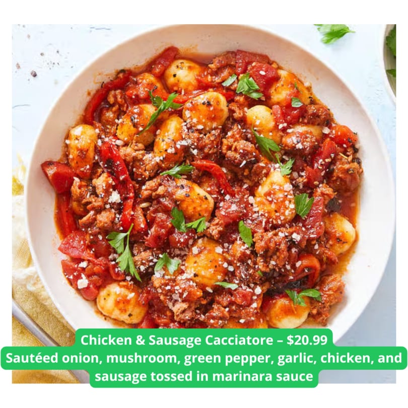 Chicken & Sausage Cacciatore with gnocchi, marinara, and parsley in a white bowl.